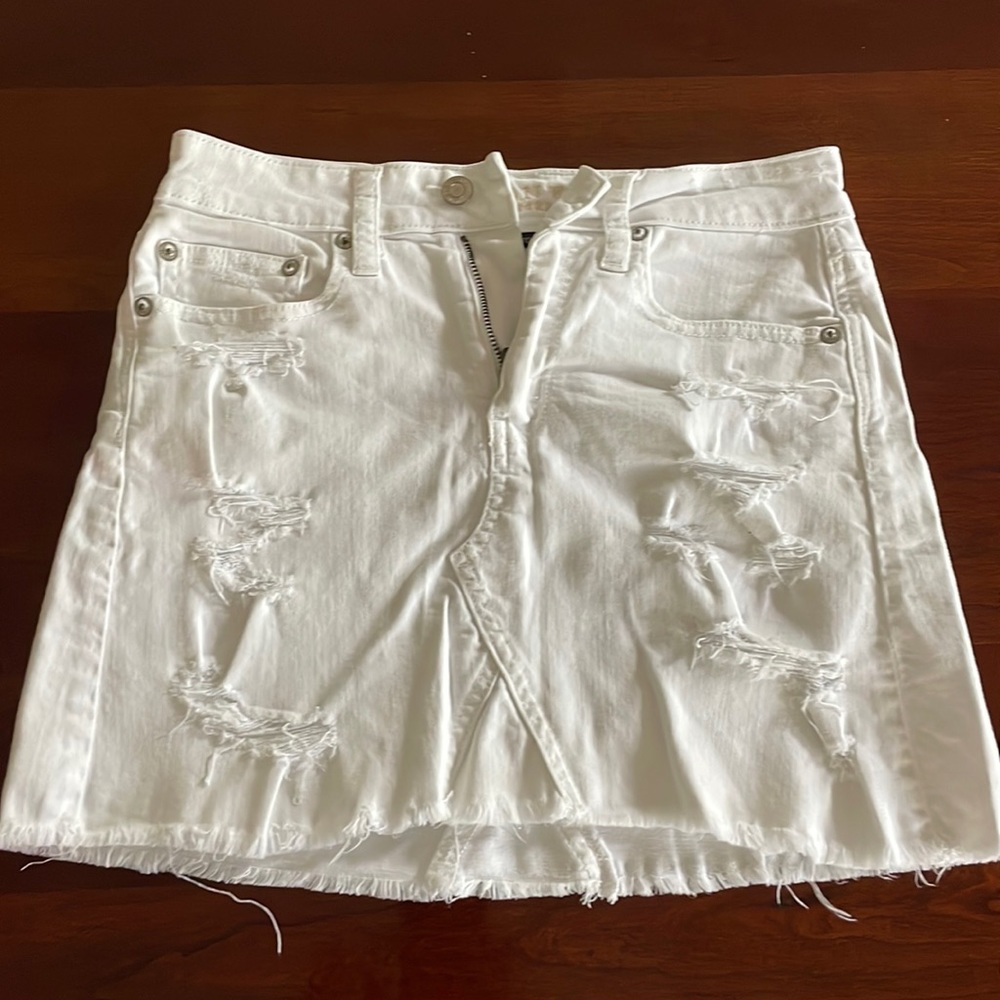 White distressed mini jean skirt